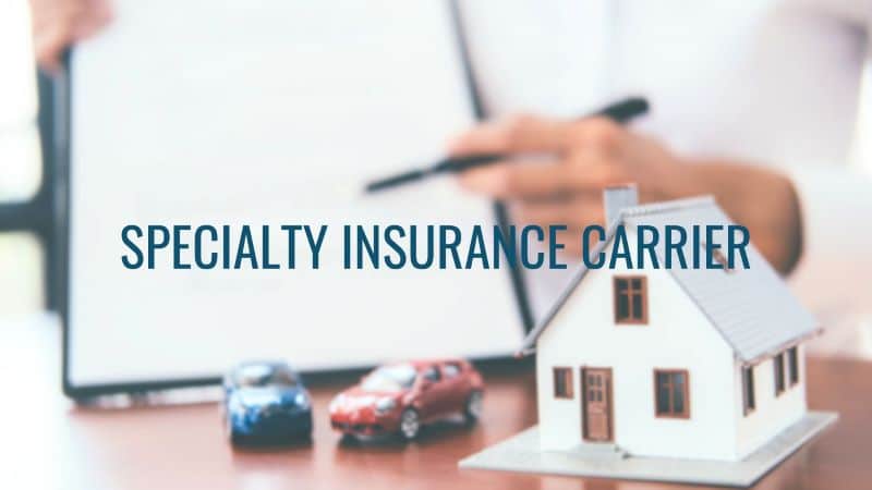 A Specialty Insurance Carrier graphic with toy cars and a model house.