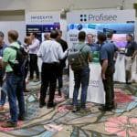 Attendees gather at the Profisee booth at the 2022 Gartner Data & Analytics Summit in Orlando, Fl.