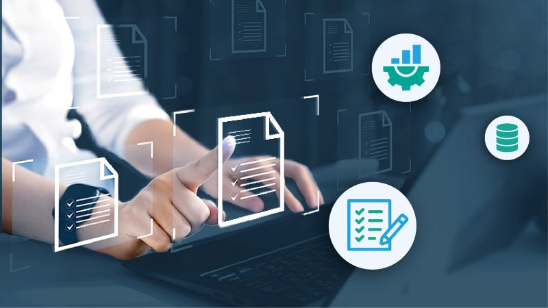 Icons representing data quality rules hover around a man working on a laptop.