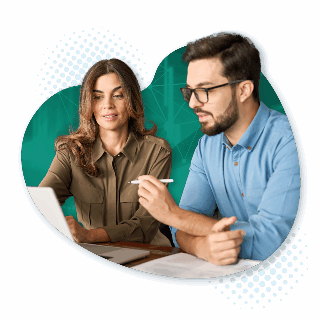 Image of a woman and man looking at a laptop.