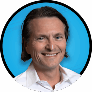 Headshot of Greg Jones on a yellow circle background.