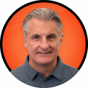 Headshot of Malcolm Hawker on a blue circle background.